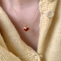 Elegant gold necklace with a red enamel heart pendant worn on a soft knit cardigan - Stainless Steel Simple Heart Necklace