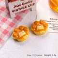 Close-up of cat paw resin charms for DIY crafts with 1x2x2.4cm size details shown - Cat Paw Bread-Cheese Flavor