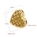 Macro detail of a 21mm hollow heart bead with hexagonal patterns for DIY jewelry - VZ459 Hollow Heart Gold