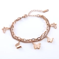 Pulsera de doble capa en acero oro rosa con dijes de mariposa mate y calados - Oro rosa