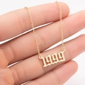 Close-up of golden stainless steel necklace with Gothic style 1999 birth year pendant - 1999 / Gold