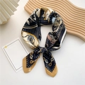 Elegant navy and gold square silk scarf with paisley pattern tied in a bow knot - Paisley Dot Chariot