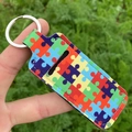 Porte-clés étui à rouge à lèvres avec imprimé puzzle coloré en néoprène durable - Puzzle Coloré
