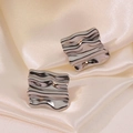 Silver square textured earrings with wavy metal design on smooth champagne satin cloth - Silver