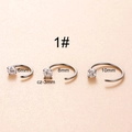 Detailed view of silver stainless steel C-shape nose rings in 6mm, 8mm, and 10mm sizes - Zircon Style (HSPJ029-1)