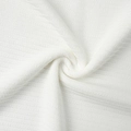 Detailed macro view showing the premium ribbed texture of white knitted fabric for summer set - Off White (100% Viscose)