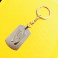 Brushed stainless steel keychain featuring a hollow-out letter W on a yellow background - Letter W