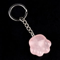 Pink quartz cat paw keychain with silver metal ring and chain on black background - Rose Quartz