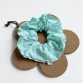 Mint green solid color oversized fabric scrunchie with a small white brand label - Large / Fresh Green