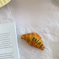 Realistic croissant shaped fridge magnet with BREAD text in orange glossy finish - Croissant