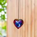 Rainbow heart crystal suncatcher ornament hanging against a natural blurred background - 30MM / Multicolor Blue