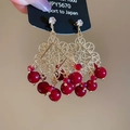 Détails de boucles d'oreilles vintage en or avec perles rouges et filigrane ajouré - Aiguille en Argent Or Rouge