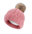Detail view of pink knit beanie with brown faux fur pom pom and warm fleece lining - Light Pink / Kids