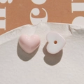 Close-up of pink and white resin heart beads with glossy finish for DIY jewelry - Pink Heart