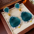 Macro detail of vintage diamond flower earrings with teal resin and yellow rhinestones - Silver Shell Style (2#)