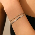Close-up of double-layer silver stainless steel bracelets with heart charm and flat snake chain - Steel Heart Steel Bead Double Layer Blade Bracelet (T207)