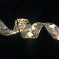 Golden and silver LED Christmas ribbon with warm glowing stars and musical notes patterns - Gold-stamped Ribbon (for Warm Lighting) / 2 Meters
