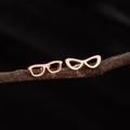 Orecchini in acciaio inossidabile oro rosa con design a occhiali su un ramo nero - Oro rosa