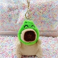 Capybara plush keychain with green frog hat on macaron foam ball background - Frog Hat Light Brown + Gold Clip