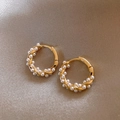 Elegant gold twisted hoop earrings with small white pearls on luxury satin cloth - Gold Twisted Rope Pearl Hoop Style (E5170)