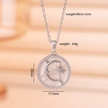 Elegant silver pendant necklace with micro-pave crescent moon and starburst design - Star and Moon / Silver