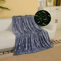 Navy blue flannel glow in the dark blanket with star moon patterns on a sofa - Spaceship / 100*150cm