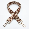 Detail of adjustable embroidered bag strap with brown geometric pattern and gold hardware - Beige Base Brown