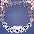Pink zebra stone beaded bracelet for grandma with white letter beads on a gift card - Dear Grandma