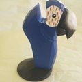 Geometric blue macaw parrot wood glasses holder stand with a black base and red accents - Blue Parrot