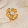 Detailed macro view of 18K gold plated flower ring with central pearl and brushed texture - Five Petal Brushed Flower Pearl Ring