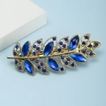Barrette à cheveux dorée en forme de feuille avec strass et gemmes bleus étincelants - Style Plume / Bleu (B5331)