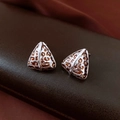 Macro shot of 14K gold plated triangular leopard print earrings with hollow metal pattern - Silver Triangle Leopard Stud Earrings