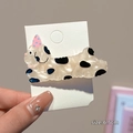 Cute 6.5cm spotted dog hair clip with pink party hat in pearlescent finish - Black and White Dog Clip
