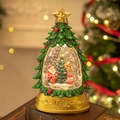 Golden Christmas tree snow globe featuring Santa Claus and reindeer on a vintage book - Christmas Tree Light