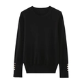 Detailed view of long sleeve knit top with decorative gold buttons on cuffs - S / Black