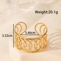 Wide vintage gold stainless steel cuff bracelet with hollow floral geometric design - Geometric Hollow Style / Gold