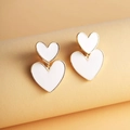 Elegant gold double heart stud earrings with white enamel finish for a sweet girl style - Gold Edge White Base Double Heart Layered Style