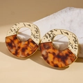 Detailed shot of round gold hammered metal earrings with amber tortoise shell finish - Coffee (925 Sterling Silver Earring Post)