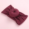 Detailed texture of burgundy knitted nylon baby headband with a decorative doughnut knot - Burgundy