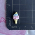 Mini resin ice cream charm for DIY crafts measuring 2.1cm by 1.1cm on a scale board - Tricolor Ice Cream