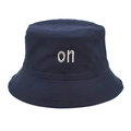 Close-up of navy cotton bucket hat featuring white letter embroidery and stitched brim - M (56-58cm) / Navy Blue