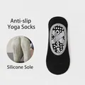 Black non-slip yoga socks with grey elastic straps and white silicone grippy soles - Black