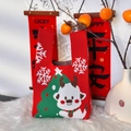 Close-up of red knit Christmas tote bag featuring festive elk and snowflake patterns - 20cm Base / Christmas Snowflake Elk