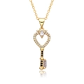 Detailed macro view of 18k gold heart key pendant with crystals and black gemstone - Black Stone Rectangular Heart Key Style (c181)