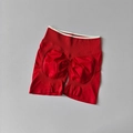 Detail view of red high waisted yoga shorts with scrunch butt lifting design - Cherry Red