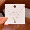 Silver pear-shaped pendant necklace with rainbow luster stone on white display card - Silver (Pear Iridescent Gem)