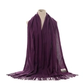 Purple cashmere feel scarf detail view showing soft texture and elegant bottom fringe tassels. - Deep purple