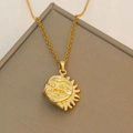 Golden sun face pendant necklace with delicate chain on textured gray display stand - XL1933 Sun Moon Combo Necklace Gold