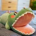 Cute green crocodile plush toy with a big mouth lying on a cozy bed for girls - 35 cm / Green