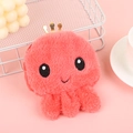 Close-up of pink plush octopus coin purse with golden crown and cute embroidery detail - Orange